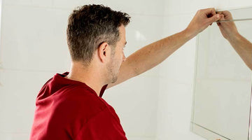 How to Hang a Bathroom Mirror Without Nails, Screws or Drilling